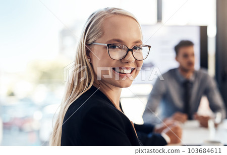 The stats are on the up and up. Portrait of a confident young businesswoman having a meeting with colleagues in the boardroom of a modern office. 103684611