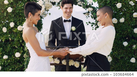 Love, holding hands and gay with lesbian couple at wedding for celebration, lgbtq and pride. Smile, spring and happiness with women at marriage event for partner commitment, romance and freedom 103684664