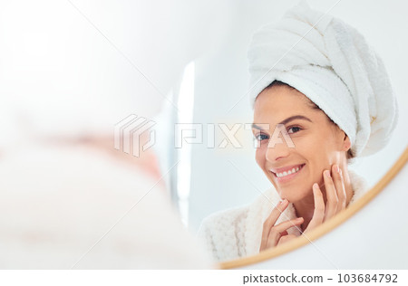 Woman, mirror and hands on face for skincare, smile and anti aging cosmetic results in bathroom. Facial, beauty and female touching soft, glow and smooth skin after luxury dermatology routine at home Woman, mirror and hands on face for skincare, smile and anti aging cosmetic results in bathroom. Facial, beauty and female touching soft, glow and smooth skin after luxury dermatology routine at home 103684792