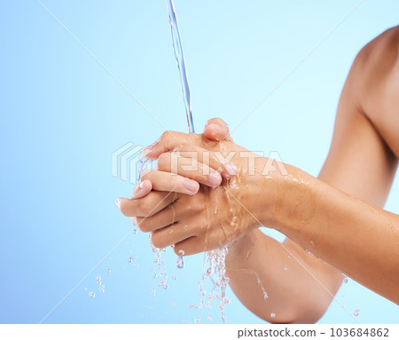 Water, woman or washing hands in studio on blue background for wellness or skincare hydration. Healthcare mockup, body care zoom or girl cleaning with liquid splash for hygiene or bacteria prevention Water, woman or washing hands in studio on blue background for wellness or skincare hydration. Healthcare mockup, body care zoom or girl cleaning with liquid splash for hygiene or bacteria prevention 103684862