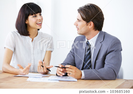 Business people are talking about paperwork in meeting, team in conference room and collaboration. Data analysis, employees coworking with man and woman in office, teamwork and plan with documents 103685160