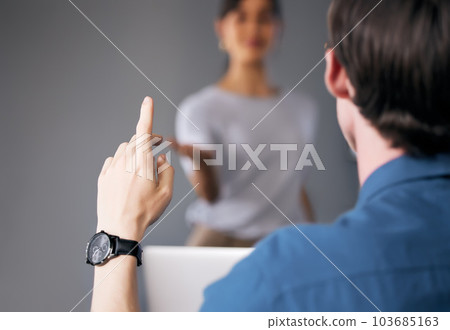 Businessman, hand and question in meeting for solution, interaction or answer at the office. Man in audience with raised hands in coaching presentation or staff training for FAQ or idea at workplace 103685163