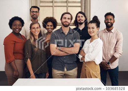Group portrait of confident, diverse and proud businesspeople standing together showing teamwork goals. Contact us and find out about us and our vision, mission and faq from our young community 103685328