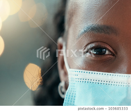 Zoom, doctor and face mask for black woman, hospital and safety from bacteria, germs and night for healthcare. African medic, nurse and dark clinic with macro, eye and portrait for wellness with ppe Zoom, doctor and face mask for black woman, hospital and safety from bacteria, germs and night for healthcare. African medic, nurse and dark clinic with macro, eye and portrait for wellness with ppe 103685333