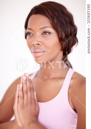 Woman, praying hands and yoga for peace in studio with gratitude, focus and breathing by white background. Girl, prayer sign and zen vision for wellness, mindfulness and spiritual health by backdrop 103685390