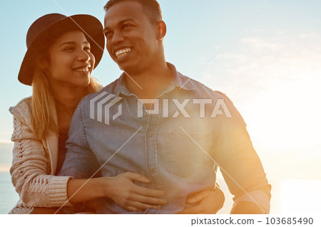 Hes so handsome and hes all mine. a happy young couple enjoying a romantic day outdoors. Hes so handsome and hes all mine. a happy young couple enjoying a romantic day outdoors. 103685490