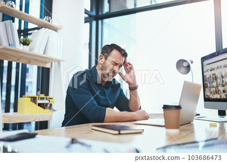 Stress, headache and businessman with laptop in the office while working on a corporate project. Medical emergency, healthcare and mature male employee with a migraine and pain in the workplace. Stress, headache and businessman with laptop in the office while working on a corporate project. Medical emergency, healthcare and mature male employee with a migraine and pain in the workplace. 103686473