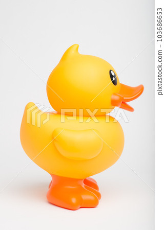 Rubber makes the world go round. Shot of a rubber duck against a studio background. Rubber makes the world go round. Shot of a rubber duck against a studio background. 103686653