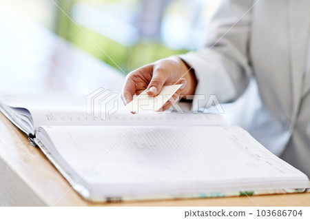 Woman, hands and credit card with book for payment, transaction or purchase for appointment or reservation. Hand of female showing debit at reception to buy, pay or shopping for booking or check in Woman, hands and credit card with book for payment, transaction or purchase for appointment or reservation. Hand of female showing debit at reception to buy, pay or shopping for booking or check in 103686704