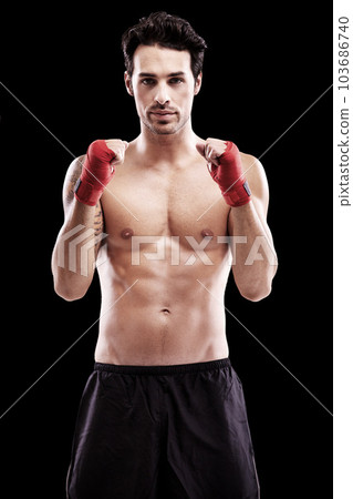 Portrait, boxer and man with fists in bandage or focus, thinking and ready for boxing fight in isolated studio black background. Athlete, martial arts and healthy fitness, strong fighter and sports 103686740