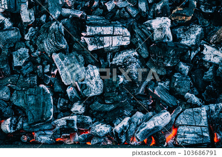 Background of burning hot coals. Burning coals in the brazier, barbecue grill 103686791
