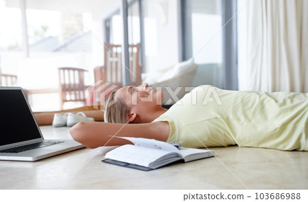Laptop, thinking and woman relax on floor with books for writing notes, ideas and brainstorming. Education, knowledge and female student laying with textbook and computer for online learning at home Laptop, thinking and woman relax on floor with books for writing notes, ideas and brainstorming. Education, knowledge and female student laying with textbook and computer for online learning at home 103686988