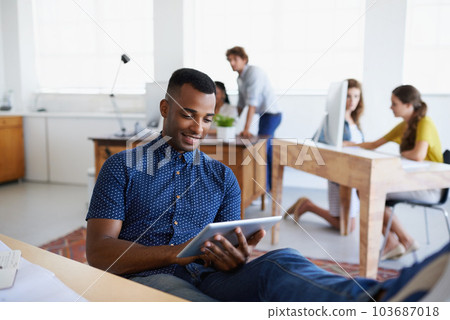Relax, architect or black man with tablet in office for engineering project or social media online. Research, digital or relaxed designer typing on web app for internet, database or architecture info Relax, architect or black man with tablet in office for engineering project or social media online. Research, digital or relaxed designer typing on web app for internet, database or architecture info 103687018