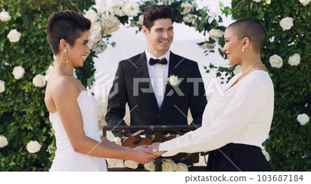 Love, holding hands and gay with lesbian couple at wedding for celebration, lgbtq and pride. Smile, spring and happiness with women at event in garden for partner commitment, queer and freedom Love, holding hands and gay with lesbian couple at wedding for celebration, lgbtq and pride. Smile, spring and happiness with women at event in garden for partner commitment, queer and freedom 103687184