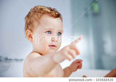 Can I have my favourite bath toy. Shot of an adorable baby boy taking a bath at home. Can I have my favourite bath toy. Shot of an adorable baby boy taking a bath at home. 103688420