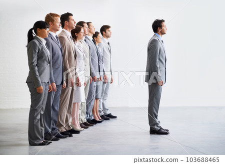 Standing to attention. A young business team awaiting the verdict on their business presentation. 103688465