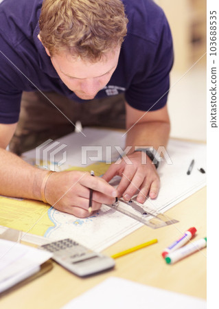 Map, man working and sea marine investigation with a drawing and ruler on a table. Sailing strategy, rescue and boat worker with navigation paperwork with lifeguard planning and distance calculation 103688535
