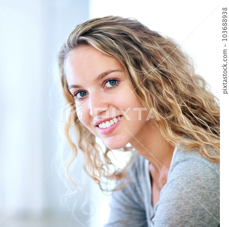 A sweet smile just for you. Portrait of a pretty young blonde smiling at you sweetly. 103688938