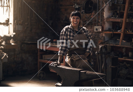 Foundry, blacksmith and portrait of woman with tools for industry, manufacturing and manual labor. Industrial factory, welding and female person for steel, iron and metal production for craftsmanship 103688948