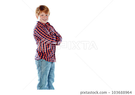 Growing up to be a confident young man. Studio portrait of a young boy posing against a white background. 103688964