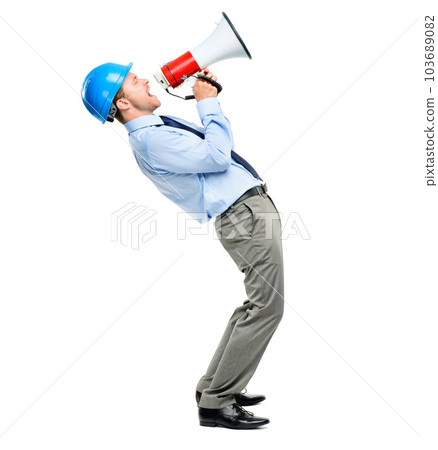 Construction worker, engineer and a man shouting into a megaphone in studio isolated on a white background. Architect, builder and a male designer screaming during a project for property development Construction worker, engineer and a man shouting into a megaphone in studio isolated on a white background. Architect, builder and a male designer screaming during a project for property development 103689082