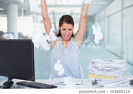 Business woman, stress and throwing paper in air for workload by office desk. Angry, upset or frustrated female employee overworked or under pressure with documents and paperwork at the workplace 103689118