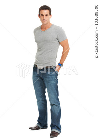 Serious young man, portrait in a studio with casual fashion and confidence with pride. White background, tshirt and modern guy style of male person, isolated, proud and confident, stylish model Serious young man, portrait in a studio with casual fashion and confidence with pride. White background, tshirt and modern guy style of male person, isolated, proud and confident, stylish model 103689300
