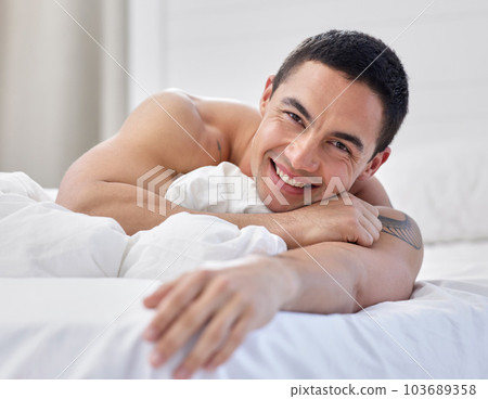 This blanket is made of boyfriend material. a handsome young man lying in bed. 103689358