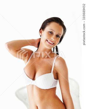 Happy woman, portrait and lingerie model in a bra on a white background for beauty, fashion and style. Sexy female with a smile in underwear for desire, seduction and self love for art deco Happy woman, portrait and lingerie model in a bra on a white background for beauty, fashion and style. Sexy female with a smile in underwear for desire, seduction and self love for art deco 103689432