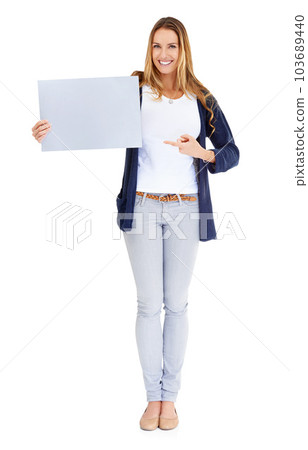Smile, showing poster and portrait of a woman isolated on a white background in a studio. Happy, mockup and a young lady with a blank paper sign for branding, news and an announcement or promotion 103689440
