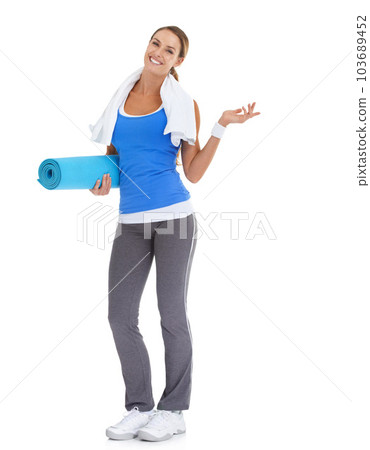 Suggesting a great fitness alternative...Fit young woman holding a pilates mat with a smile - isolated on white. 103689452