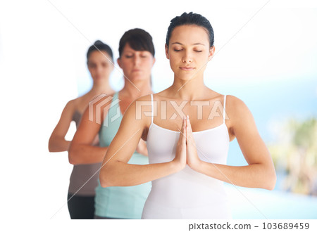 Prayer hands, meditation and woman with yoga exercise outdoor with zen and pilates instructor. Spiritual, namaste and wellness of training, workout and peace from fitness friends group feeling calm 103689459