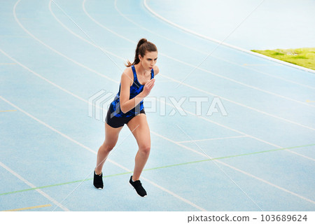 Woman, running and stadium track of athlete in fitness, exercise or workout for cardio training outdoors. Fit, active or sporty female person, runner or sprinting competition for exercising or race Woman, running and stadium track of athlete in fitness, exercise or workout for cardio training outdoors. Fit, active or sporty female person, runner or sprinting competition for exercising or race 103689624