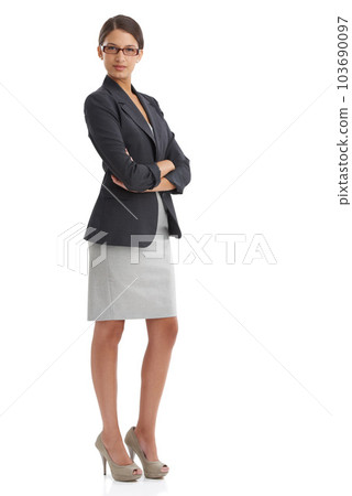 Ready to take on the corporate world. Studio shot of an confident young businesswoman isolated on white. 103690097