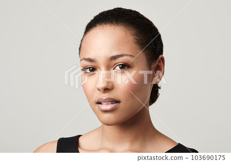 Black woman, portrait and natural beauty with confidence and cosmetics in a studio feeling proud. Isolated, white background and young face of a African female person and model with makeup and pride Black woman, portrait and natural beauty with confidence and cosmetics in a studio feeling proud. Isolated, white background and young face of a African female person and model with makeup and pride 103690175