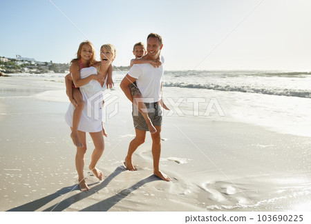 Family, beach and fun of mother, father and kids together with a piggy back outdoor in nature. Sea, smile and happiness with bonding, parent support and love while laughing by the ocean on holiday 103690225