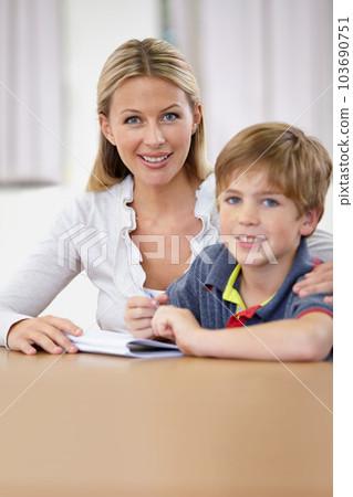Portrait, teacher and child learning in classroom, smile and education in class. Happiness, student and woman educator teaching, helping or tutoring kid for studying or knowledge in elementary school 103690751