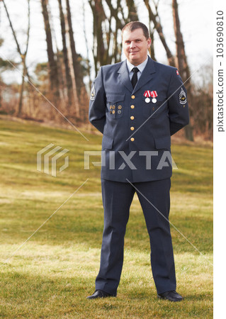 Portrait, Denmark and veteran general or official in uniform or flag on sleeve and male soldier outdoors. Danish military, hero and badge of honor or man officer or security and courage for war Portrait, Denmark and veteran general or official in uniform or flag on sleeve and male soldier outdoors. Danish military, hero and badge of honor or man officer or security and courage for war 103690810
