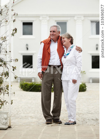 Admiring the scenics they will get to enjoy - Vacation. Full length of a senior couple embracing each other in the courtyard of their hotel. Admiring the scenics they will get to enjoy - Vacation. Full length of a senior couple embracing each other in the courtyard of their hotel. 103690877
