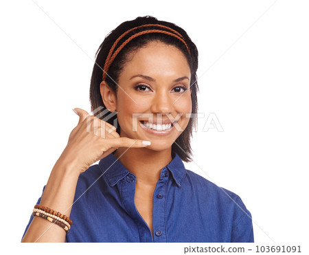 Call me. An attractive young woman making the call me gesture while isolated on a white background. Call me. An attractive young woman making the call me gesture while isolated on a white background. 103691091