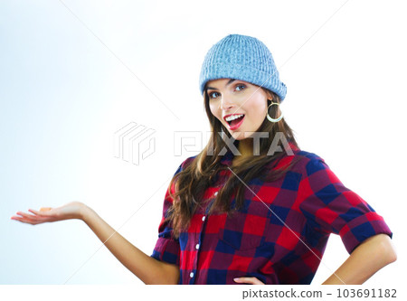 Making its awaited appearance. a young woman posing against a white background. 103691182
