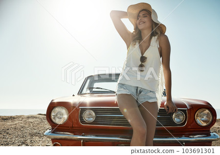 Road tripping is the ultimate freedom. an attractive young woman on a road trip. Road tripping is the ultimate freedom. an attractive young woman on a road trip. 103691301