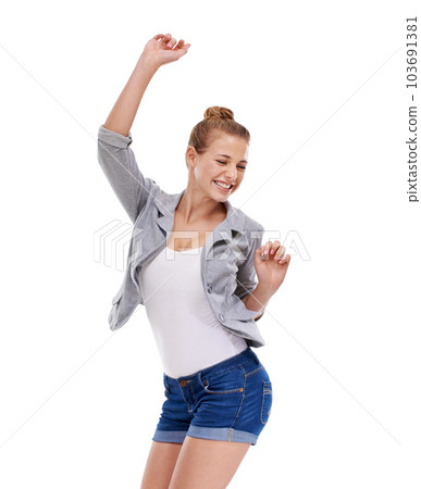 Overwhelmed with happiness. A beautiful young woman cheering against a white background. 103691381