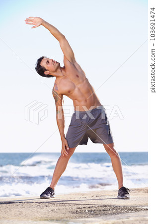 Fitness, man and stretching body on beach - Stock Photo