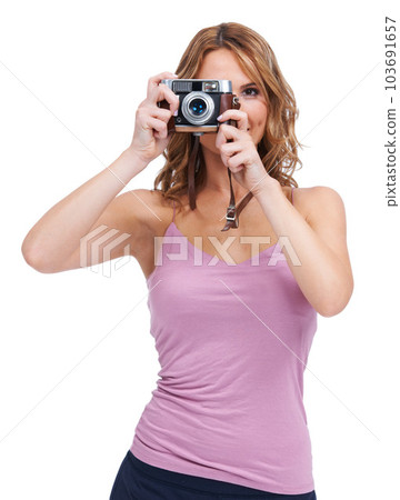Photography, camera and portrait of woman photographer taking a picture isolated in a studio white background. Vintage, retro and creative female person or professional shooting with focus and lens 103691657