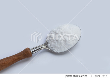 Baking soda on white background. Baking soda on white background. 103691933