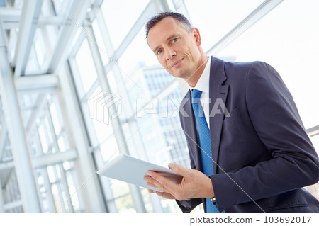 Portrait, planning or business man on tablet for invest strategy, finance growth or financial review. Networking manager in office building for social network, data analysis or economy data research Portrait, planning or business man on tablet for invest strategy, finance growth or financial review. Networking manager in office building for social network, data analysis or economy data research 103692017