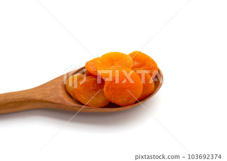 Dried apricots on white background. 103692374