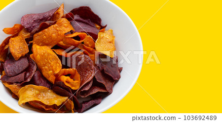 Purple and yellow sweet potato chips Purple and yellow sweet potato chips 103692489