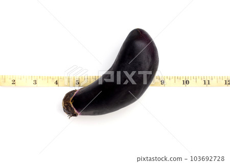 Eggplant on measuring tape on white background. Eggplant on measuring tape on white background. 103692728